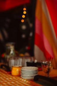 a table with plates and a glass and a flag at Limon Inn Hotel, Taşucu in Tasucu