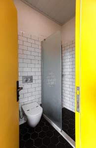 a bathroom with a toilet and a shower stall at Limon Inn Hotel, Taşucu in Tasucu