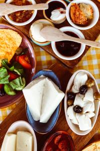 a table full of plates of food with different foods at Limon Inn Hotel, Taşucu in Tasucu