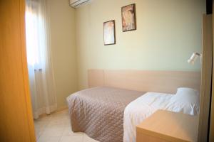 Postel nebo postele na pokoji v ubytování Hotel Dei Tartari
