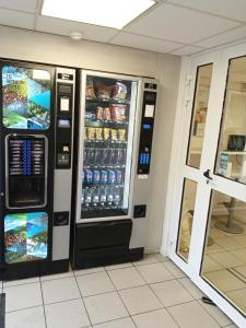 a drink vending machine in a restaurant at Premiere Classe Saint Brice Sous Foret in Saint-Brice-sous-For&ecirc;t