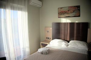 Postel nebo postele na pokoji v ubytování Hotel Dei Tartari