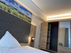 Postel nebo postele na pokoji v ubytování Hotel Restaurant Roemer