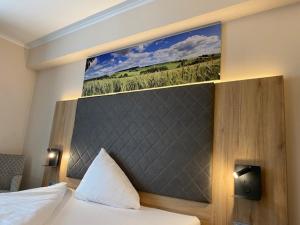 Postel nebo postele na pokoji v ubytování Hotel Restaurant Roemer
