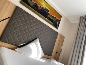 Postel nebo postele na pokoji v ubytování Hotel Restaurant Roemer
