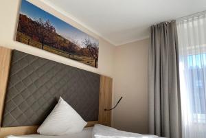 Postel nebo postele na pokoji v ubytování Hotel Restaurant Roemer
