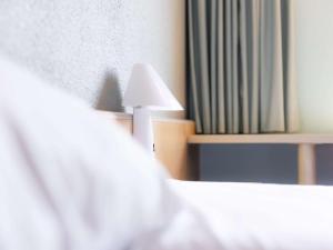 Postel nebo postele na pokoji v ubytování ibis Vesoul