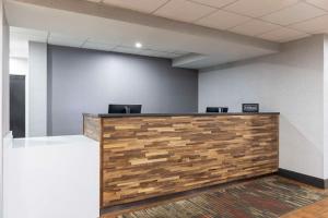 an office cubicle with a wooden reception counter at Hampton Inn Athens in Athens