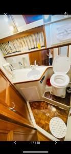 a bathroom with a toilet and a sink at Yacht y fiestas in Barcelona