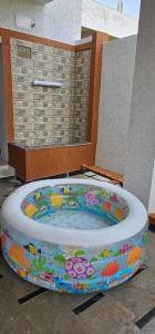 a bath tub in a room with a shower at Private stay - close to the Airport secure parking in Surūrnagar