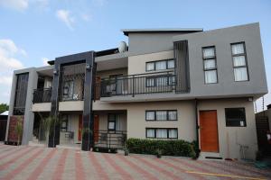 a large apartment building with a lot of windows at The Edge Lodge in Polokwane