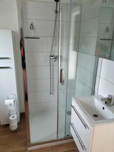 a bathroom with a shower and a sink at Dom nad morzem u Ewy Chłopy in Chłopy