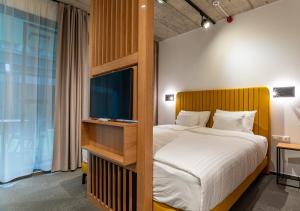Postel nebo postele na pokoji v ubytování Noir Hotel