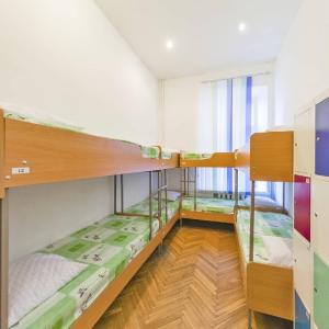 Postel nebo postele na pokoji v ubytování Muzey Hostel