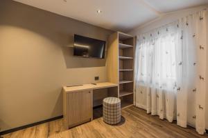 TV a/nebo společenská místnost v ubytování Suàn Hotel