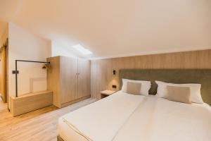 Postel nebo postele na pokoji v ubytování Suàn Hotel