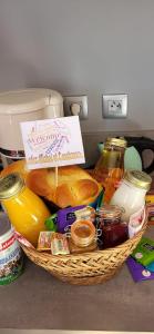 a basket filled with bread and other food on a counter at La Bastide du Canal in Carcassonne