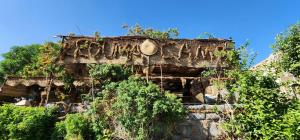 an old building with vines growing on it at Krouma Camp & Ecolodge in Aswan