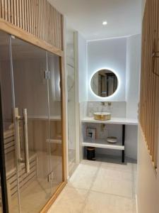 a bathroom with a sink and a mirror at Bordeaux cosy home in Bordeaux