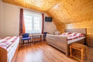 Postel nebo postele na pokoji v ubytování Dom Gościnny Ewa