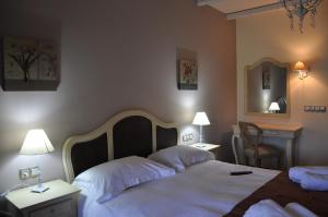Postel nebo postele na pokoji v ubytování Thisoa Hotel