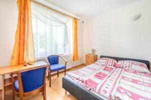 Postel nebo postele na pokoji v ubytování Dom Gościnny Ewa