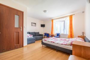 Postel nebo postele na pokoji v ubytování Dom Gościnny Ewa