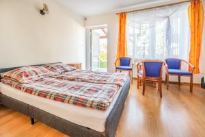 Postel nebo postele na pokoji v ubytování Dom Gościnny Ewa