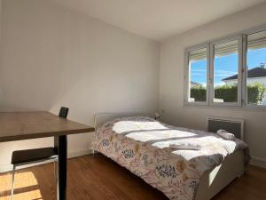 Posteľ alebo postele v izbe v ubytovaní Maison plain-pied Tarbes