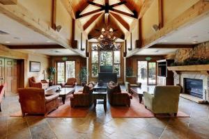 a large living room with couches and a fireplace at Mountain Thunder Lodge in Breckenridge