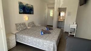 a bedroom with a bed with blue pillows on it at B&B Casa Sardonyx in Calpe