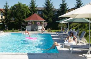 The swimming pool at or close to GASTHOF SCHEER Feriendomizil