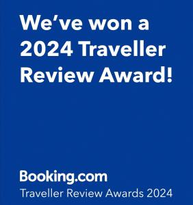 a blue sign that says were won a traveller review award at Le Paul Chandon Centre-ville 4 pers in Épernay