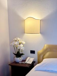 A bed or beds in a room at Hotel Relais Il Cestello