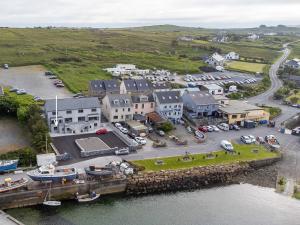an aerial view of a small town with a marina at Cleggan Pierside Apt 2 in Cleggan