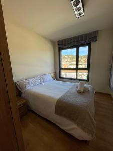 Postel nebo postele na pokoji v ubytování Niu Turistic Olvan