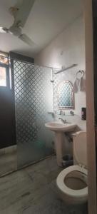 a bathroom with a toilet and a sink at Luxe Ganga view Villa with Terrace Seating (Vacaow) in Rishīkesh