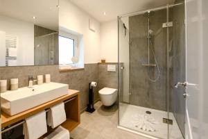 a bathroom with a sink toilet and a shower at Chalet Alpenflair I in Garmisch-Partenkirchen +29 photos