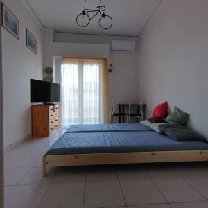 Postel nebo postele na pokoji v ubytování Loutraki-SPA-Apartment