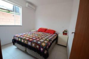 A bed or beds in a room at Casa Campeche 5 minutos, a Pé, da Praia