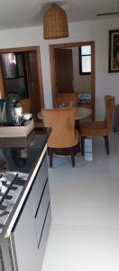 a kitchen with a table and a dining room at BRIECH HOUSE in Asilah