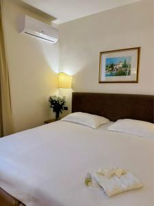 A bed or beds in a room at Hotel Relais Il Cestello