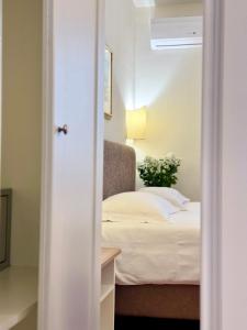 A bed or beds in a room at Hotel Relais Il Cestello