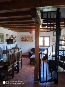 a living room with a table and a dining room at Villa El Salinar en Salamanca. Ideal familia/grupo in Calvarrasa de Abajo