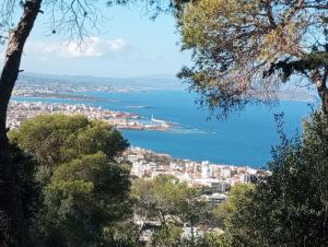 a view of a city and the ocean at Sunny family apartment in Chania close to the sea in Chania Town