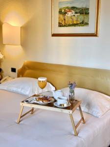 A bed or beds in a room at Hotel Relais Il Cestello