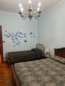 Postel nebo postele na pokoji v ubytování Casa Inglese, appartamento a pochi passi da Inalpi Arena