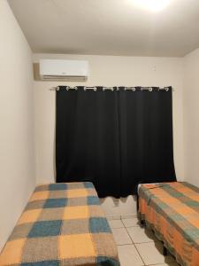 Säng eller sängar i ett rum på Casa Tokio