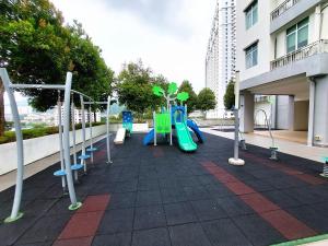 a playground with a slide and swings at SR28-HousePrivate-3room-BigHouse in Bayan Lepas