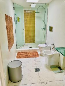 a bathroom with a shower and a toilet and a sink at Palais Belle Epoque - Property With Style in Cannes